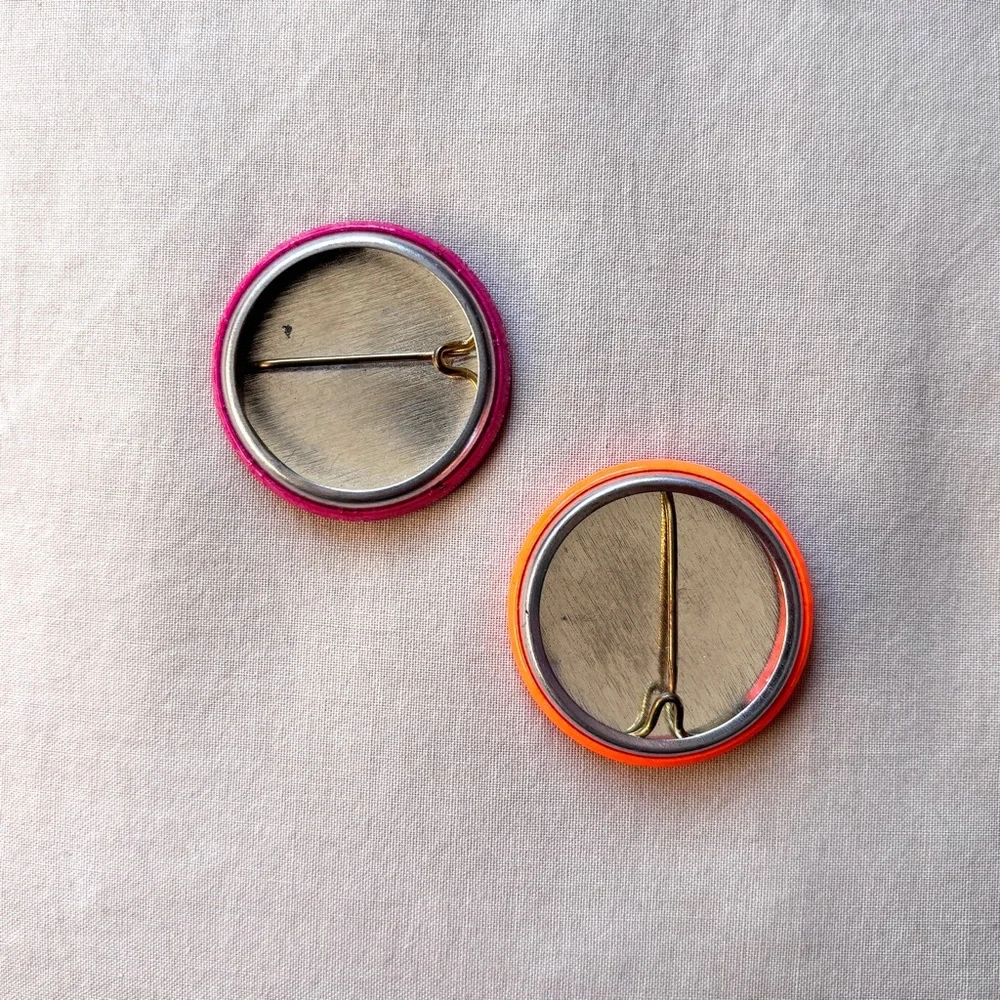 1990s smiley face neon orange and dark magenta pink button pins